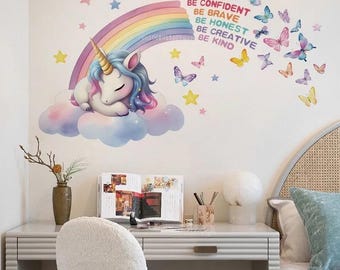 May include: A wall decal featuring a sleeping unicorn with a rainbow mane and horn, resting on a cloud. Butterflies and stars surround the unicorn, with text that reads "Be Confident, Be Brave, Be Honest, Be Creative, Be Kind."