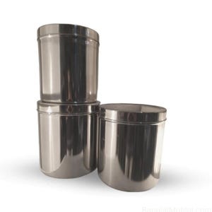 May include: Three stainless steel canisters with lids are stacked and arranged on a white background. The canisters are cylindrical with a shiny, reflective surface. The lids fit snugly on top, creating a clean, modern look.