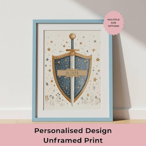 May include: Framed print featuring a shield and sword design with the name "Oliver" on a banner. The artwork has a blue and gold color scheme with star and floral accents. The print is in a light blue frame.
