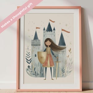 May include: A framed print featuring a cartoon illustration of a young knight standing before a castle. The knight holds a shield and sword. The castle has blue and gray turrets with orange flags. The frame is pink, and the text "Makes a thoughtful gift" is on the image.