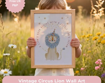 May include: A framed vintage circus lion wall art print. The illustration features a lion with a blue mane and a party hat, with the text "A lion's roar begins with a little cub's dream" around it.