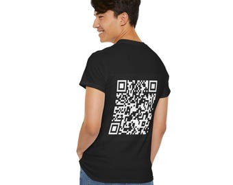 May include: Black t-shirt with a large white QR code printed on the back. The shirt is short-sleeved and made of a soft material. The person is wearing blue jeans.