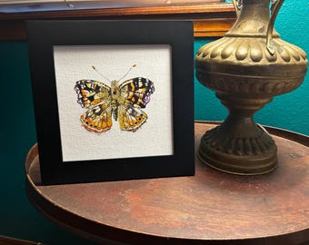 Ręcznie malowany motyl akwarelowy: lśniące kolory monarchy