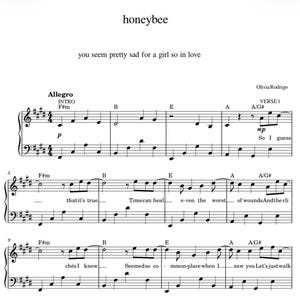 May include: A sheet music page titled honeybee by Olivia Rodrigo, featuring the lyrics you seem pretty sad for a girl so in love. The score includes piano notation with chords like F#m, B, E, A, and A/G# across three staves with lyrics.