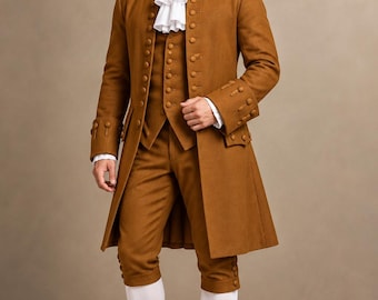May include: A brown three-piece suit featuring a long coat, a vest, and knee-length breeches with button details. The outfit includes a white ruffled cravat and white stockings. The ASWN BROTHERS logo is visible in the top right corner.