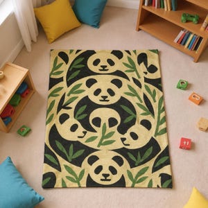 May include: A rectangular rug featuring a repeating pattern of panda faces and green leaves on a beige background. The panda faces are black and white, and the leaves are green. The rug is placed on a light beige carpet.