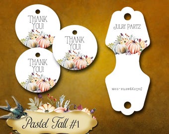 May include: Three round pastel-colored thank you tags with a watercolor design of pumpkins and fall foliage. A white tag with a scalloped edge and the text "JULRY PARTZ" and "julrypartz.com" in black text. The text "Pastel Fall #1" is in a gold frame.