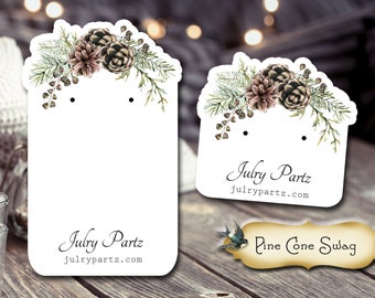 May include: White earring display card with a watercolor pine cone and greenery design. The card has two holes for earrings and the text "Julry Partz julrypartz.com" at the bottom. A separate card with the same design has the text "Pine Cone Swag" at the bottom.