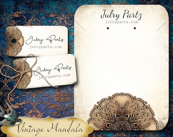 Peut inclure: Une carte blanche avec un motif de mandala doré en bas. La carte porte le texte "Julry Partz" et "julrypartz.com" en haut. La carte est sur un fond bleu et or.