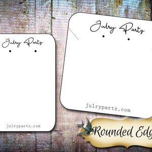 May include: Two white card earring display cards with rounded edges. The cards have the text "Julry Parts" and "julrypartz.com" printed on them. The larger card has the text "Rounded Edge" printed on it.
