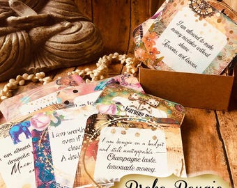 May include: A set of square affirmation cards with colorful, patterned borders and printed text. One card reads, I am allowed to make money mistakes without shame - lessons, not losses. Another reads, I am bougie on a budget and still unstoppable - Champagne taste, lemonade money.