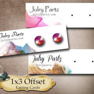 May include: Three white earring cards with a watercolor background and the text "Julry Partz" and "julrypartz.com". The cards have two holes for displaying earrings. The text "1x3 Offset Earring Cards" is displayed below the cards.