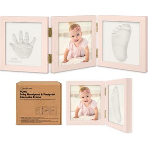 May include: A pink baby handprint and footprint keepsake frame. The frame has three panels, one with a handprint, one with a photo of a baby, and one with a footprint. The box reads "Baby Handprint & Footprint Keepsake Frame."