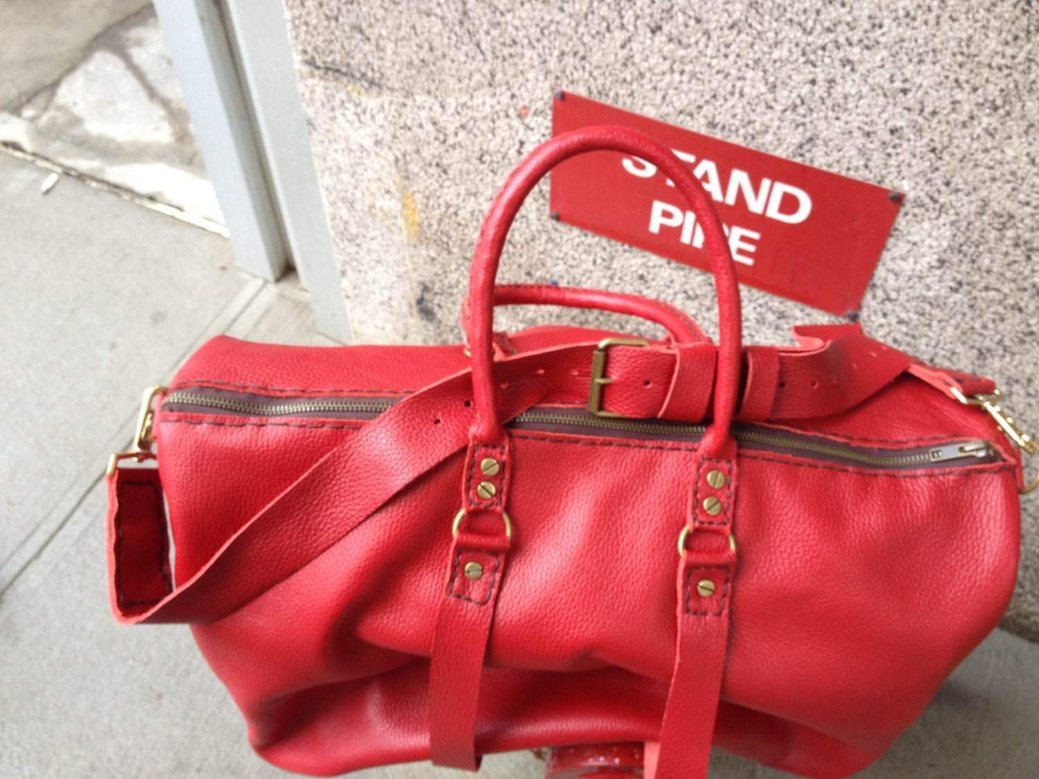 Red leather overnight bag hotsell
