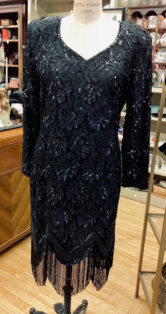 This fabulous LBD has big time bling with an elega
