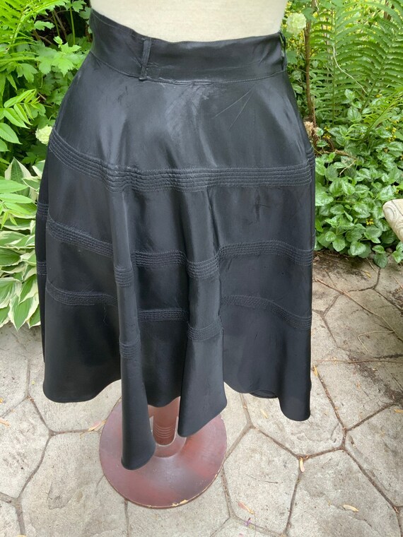 Black satin skirt from the 1950s.  Get ready to ro