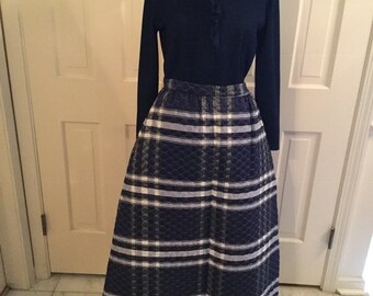 Mary Tyler Moore, much?  Navy quilted skirt and ribbed turtleneck; you&#39;re gonna make it after all.