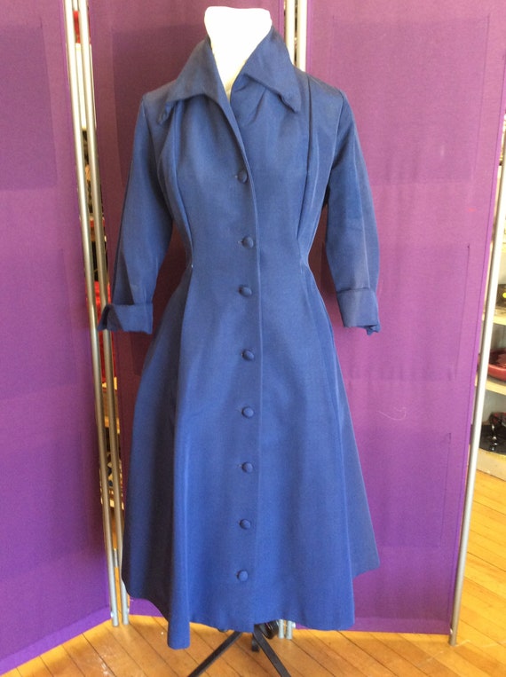Coat-dress in navy feuille is anything but all bus