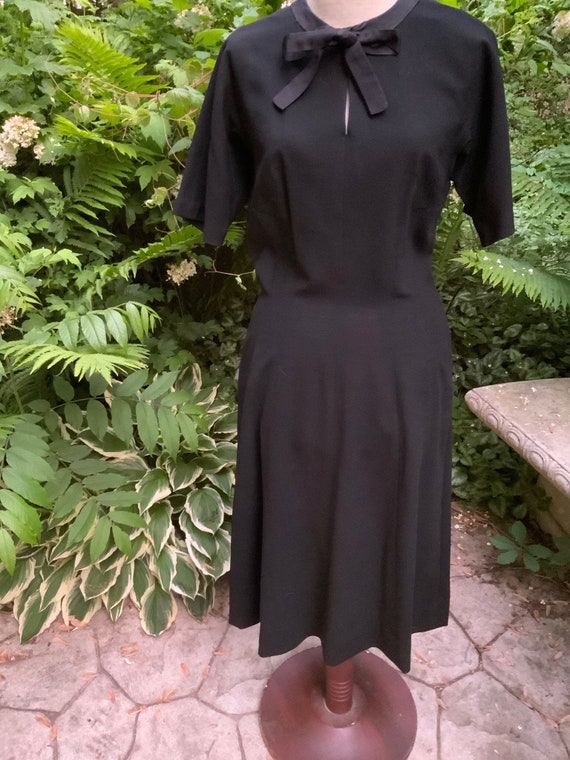 1950s black wool dress will put you at the top of 