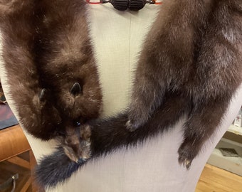 Dark-colored mink stole with 3 full pelts