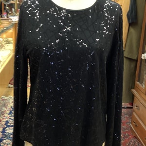 Laura Ashely top sparkles as brightly as you do.  Size Petite Large