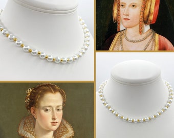 May include: A white pearl necklace with gold accents on a white mannequin bust. The necklace is also shown on a painting of a woman wearing a similar necklace.