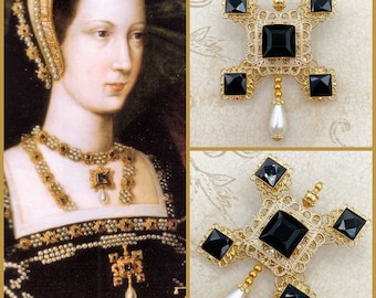 May include: A gold-tone pendant necklace with a black stone and a pearl drop. The necklace is on a black velvet background.