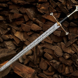 May include: A double-edged sword featuring a distinct wavy Damascus steel pattern on the blade. The hilt includes a metallic crossguard with pointed ends, a black wrapped grip, and a metallic pommel with an engraved triangular design.