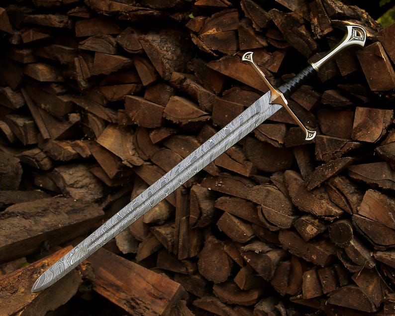 May include: A double-edged sword featuring a distinct wavy Damascus steel pattern on the blade. The hilt includes a metallic crossguard with pointed ends, a black wrapped grip, and a metallic pommel with an engraved triangular design.