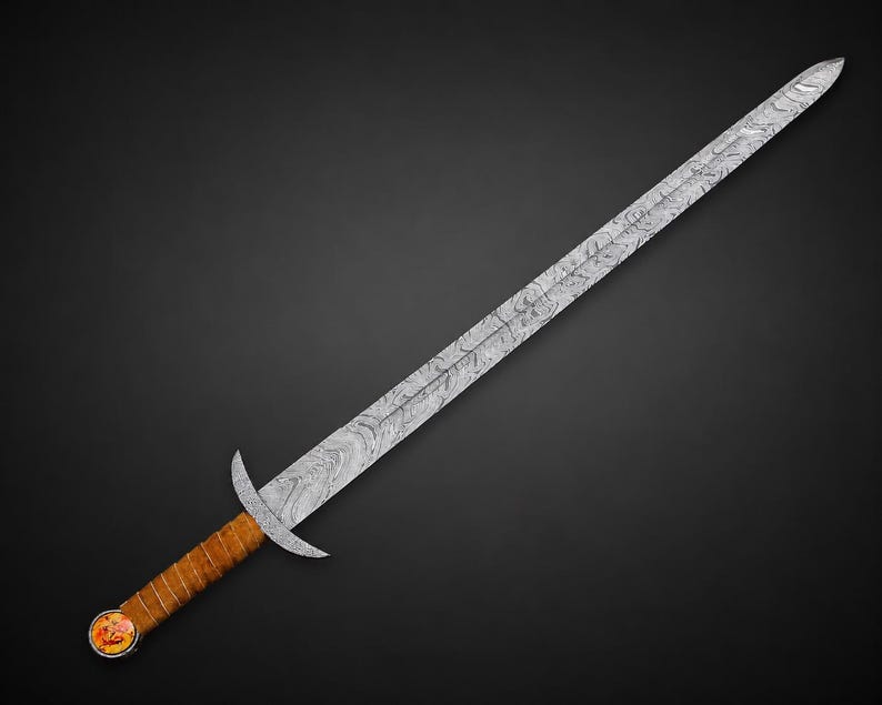 May include: A long sword featuring a double-edged blade with a distinct wavy Damascus steel pattern. The hilt includes a simple metal crossguard, a brown leather-wrapped grip, and a circular pommel with a colorful circular inlay at the base.