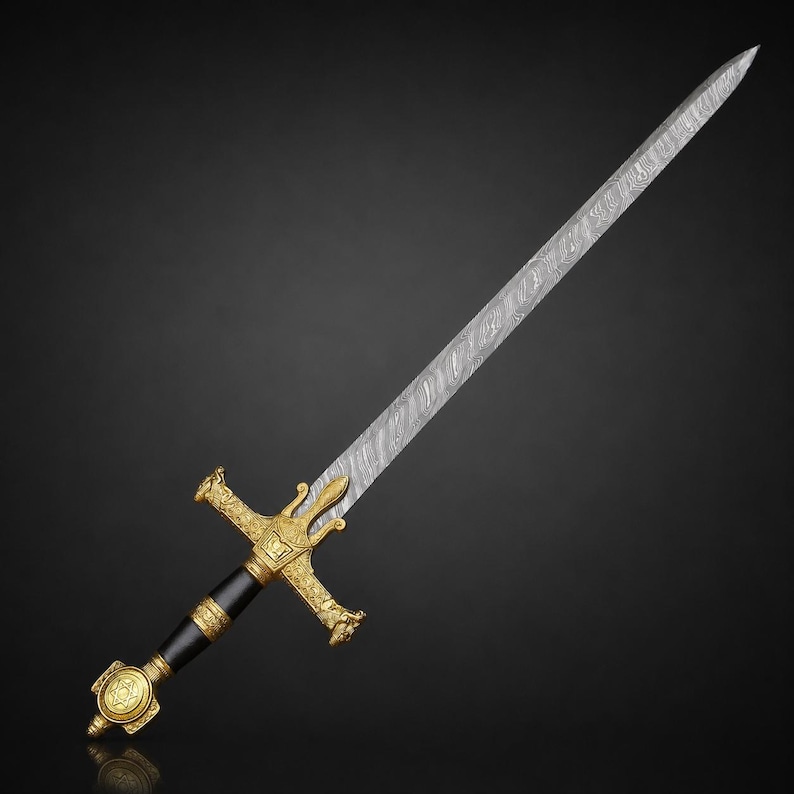 May include: A sword featuring a long, pointed blade with a distinct wavy Damascus steel pattern. The hilt is composed of a black cylindrical grip, a gold-colored crossguard with ornate detailing, and a gold-colored pommel with a star emblem.