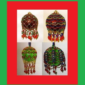 May include: Four beaded Christmas ornaments. Two are red and two are green. Each ornament is covered in a beaded net with beaded fringe. The ornaments have gold, red, blue, and green beads. The ornaments are hanging from a gold cap.