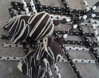 Chocolate covered Marshmallows dipped in dark Belgian chocolate and drizzled with white Belgian chocolate