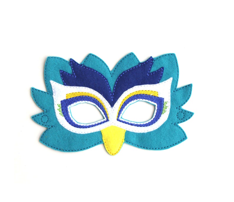 May include: A blue, yellow, and white felt bird mask with a beak and eye holes.