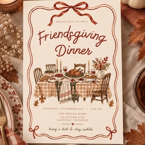 May include: A rectangular Friendsgiving dinner invitation card with a cream background and a rust-colored ribbon border. The text reads: Please join us for a Friendsgiving Dinner, Saturday, November 21st, 6:00 PM, The Miller Home, 123 Autumn Lane, Nashville, Tennessee, bring a dish & stay awhile. An illustration shows a table set with a turkey, food, and candles.