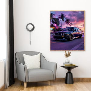 May include: A framed print of a black sports car on a road at sunset. The image features palm trees, neon signs, and a vibrant purple and pink sky. The car has gold rims.