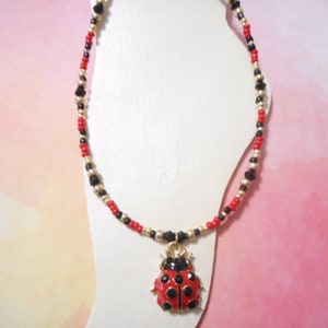 Red, Black, And Gold Charm Ankle Bracelet