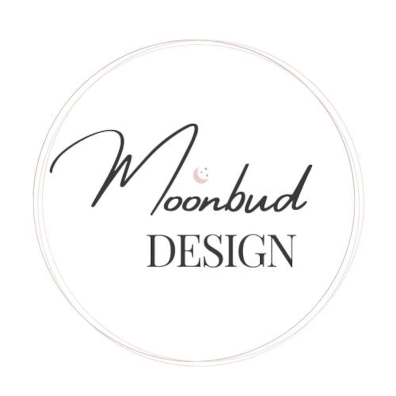 May include: Circular logo with the text "Moonbud DESIGN" in black script and sans-serif font, respectively. A small crescent moon graphic is above the "u" in "bud". The logo is enclosed within a double, thin, light-brown circle, set against a white background.