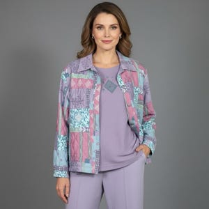 May include: A quilted jacket featuring a multi-colored patchwork pattern in shades of lavender, teal, and pink, worn over a solid lavender top and matching lavender trousers. The jacket has a classic collar, long sleeves, and a button-front closure.