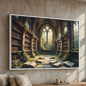 May include: A framed print depicts a detailed, fantasy library scene. Bookshelves line the walls, filled with books. Open books are scattered on the floor. The scene is bathed in sunlight streaming through arched windows, creating a warm, inviting atmosphere.