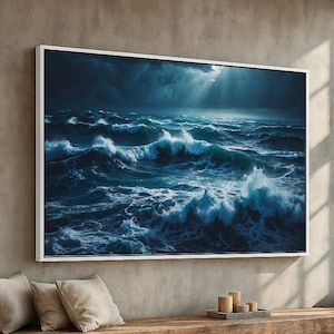 May include: A large framed canvas print depicts a stormy ocean scene. The artwork showcases powerful waves in shades of blue and white, under a dramatic, dark sky with a hint of sunlight. The print is mounted on a neutral-toned wall.
