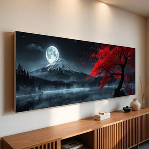 May include: A large rectangular canvas print depicting a nighttime landscape. A full moon shines over a snow-capped mountain, with a red-leafed tree on the right. The scene includes a lake and dark trees.