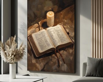 May include: A framed canvas print depicts an open book with text, a lit candle, and a leather bookmark. The artwork is rendered in warm, earthy tones of brown and beige, creating a serene and contemplative atmosphere. The candle's flame casts a soft glow.