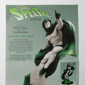 May include: A hand-painted porcelain statue of the Spectre, a DC Comics superhero, standing on a tombstone. The statue is approximately 8 inches tall, 8.5 inches wide, and 6.25 inches deep. The Spectre is depicted in a green hooded costume, with a white body and a green cape. The statue is a hauntingly beautiful piece of art.