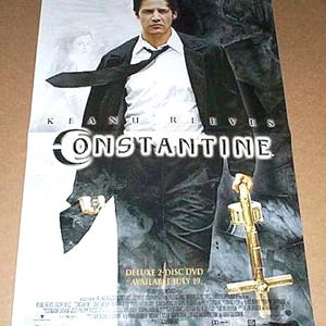 May include: Movie poster for the film "Constantine" featuring Keanu Reeves. The poster has a dark, moody aesthetic with Reeves in a suit, holding a golden cross. The title is prominently displayed, along with DVD details.