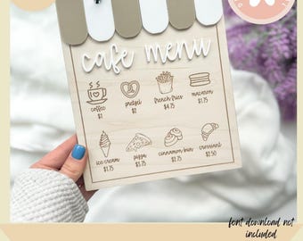 May include: Wooden cafe menu board with a white and tan awning design. The menu includes illustrations of coffee, pretzels, fries, macarons, ice cream, pizza, cinnamon buns, and croissants. Text on the board reads "cafe menu" and "instant digital download svg".
