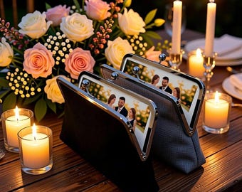 May include: Two rectangular clutch bags with silver metal frames and ball clasps. Each bag features a custom photo print on the front panel showing a couple. The bags are displayed on a wooden table surrounded by lit candles and a bouquet of roses.