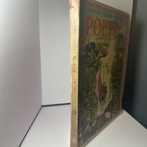 May include: Vintage "The Big Golden Book of Poetry" with a colorful cover illustration. The cover features a whimsical scene with trees, figures, and the title in red. The spine displays the title and publisher.