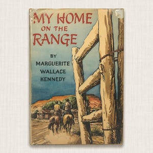 May include: A vintage hardcover book titled My Home on the Range by Marguerite Wallace Kennedy. The cover features a color illustration of two people on horseback riding past a wooden fence toward a desert landscape with red rock mesas.