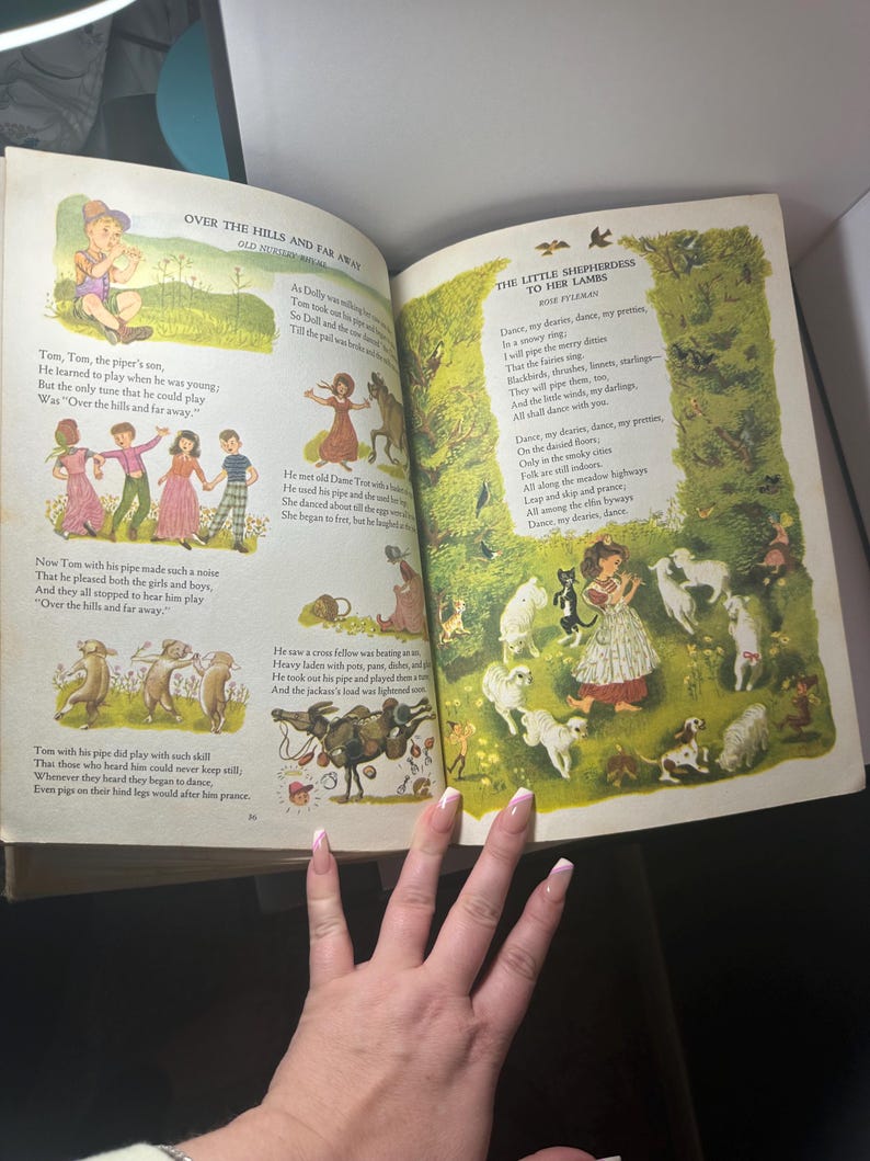 May include: Open book with colorful illustrations and text. The left page features a poem titled "Over the Hills and Far Away" with illustrations of children and animals. The right page has a poem titled "The Little Shepherdess to Her Lambs".